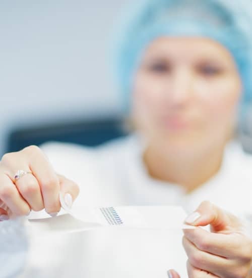 A woman holding a surgical film